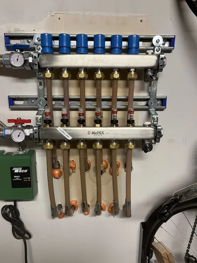 Plumber performing Water Heater Repair at a residential property in Minooka